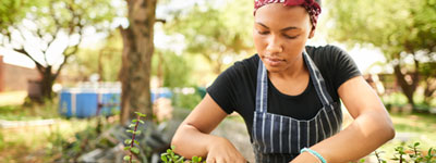 woman tending to plants