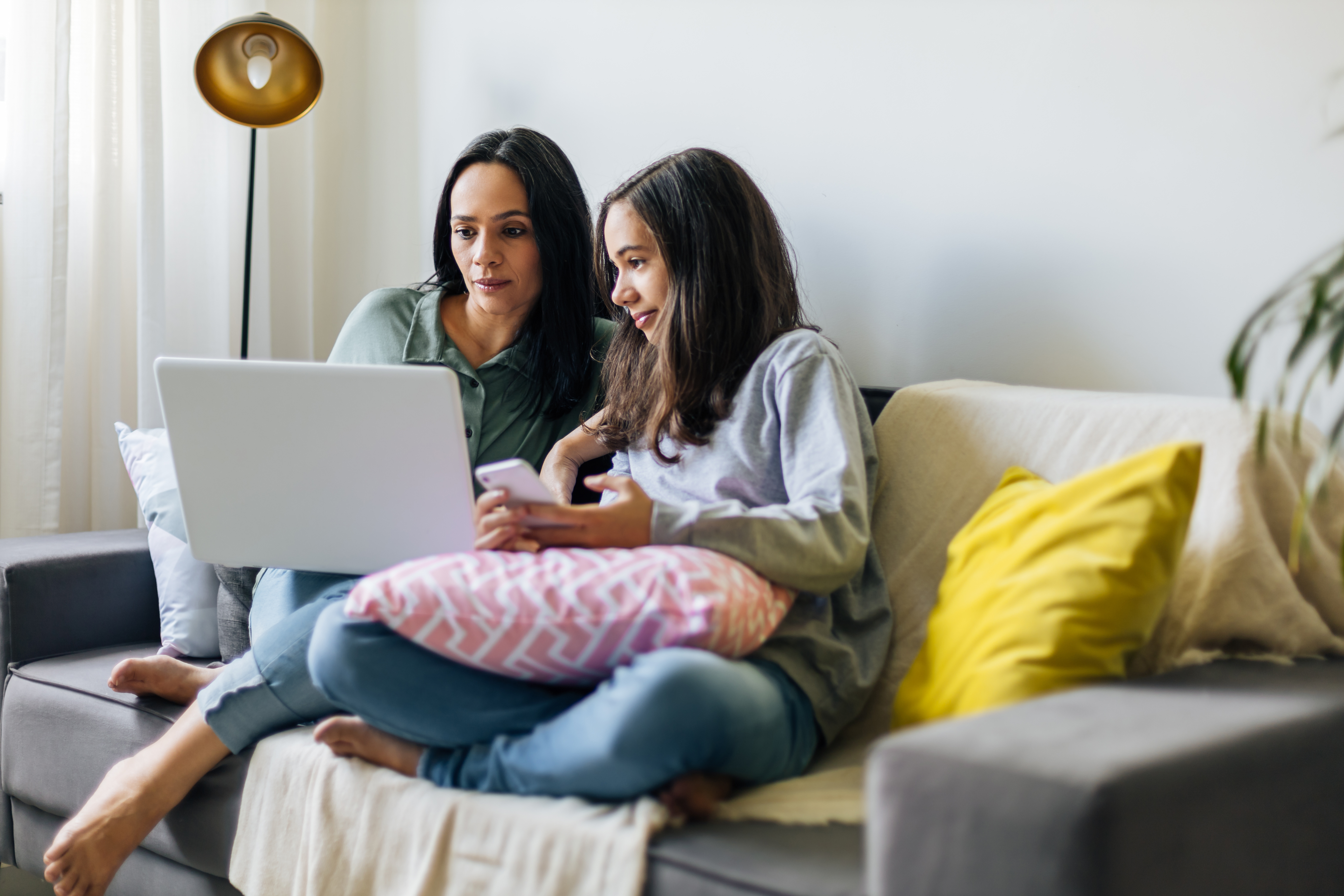 Mother and daughter playing on computer