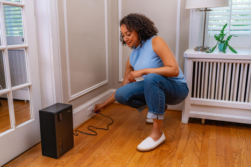 Woman unplugging device 