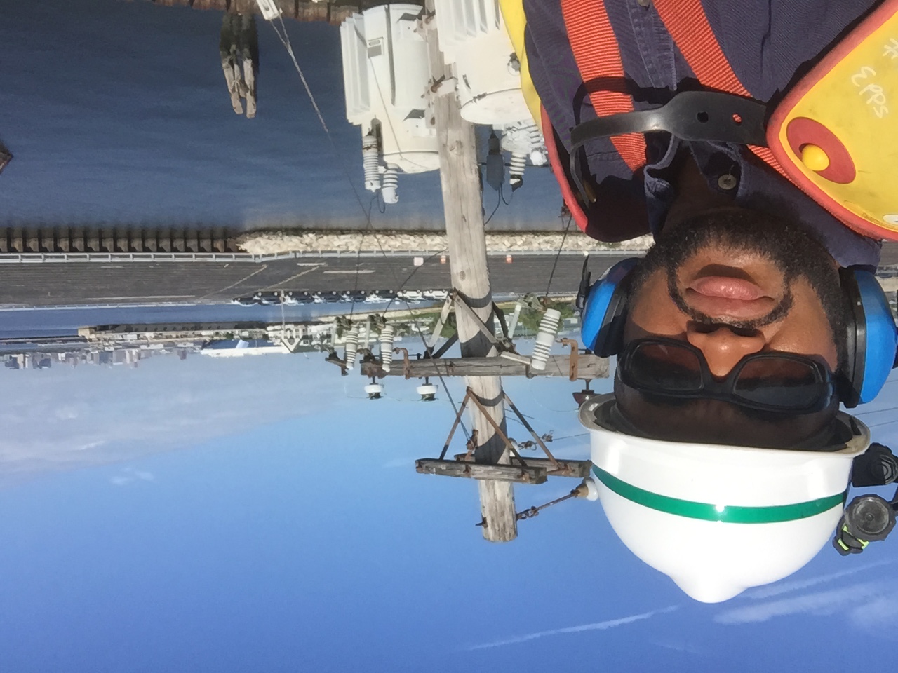 James Epps at work beside a utility pole. 