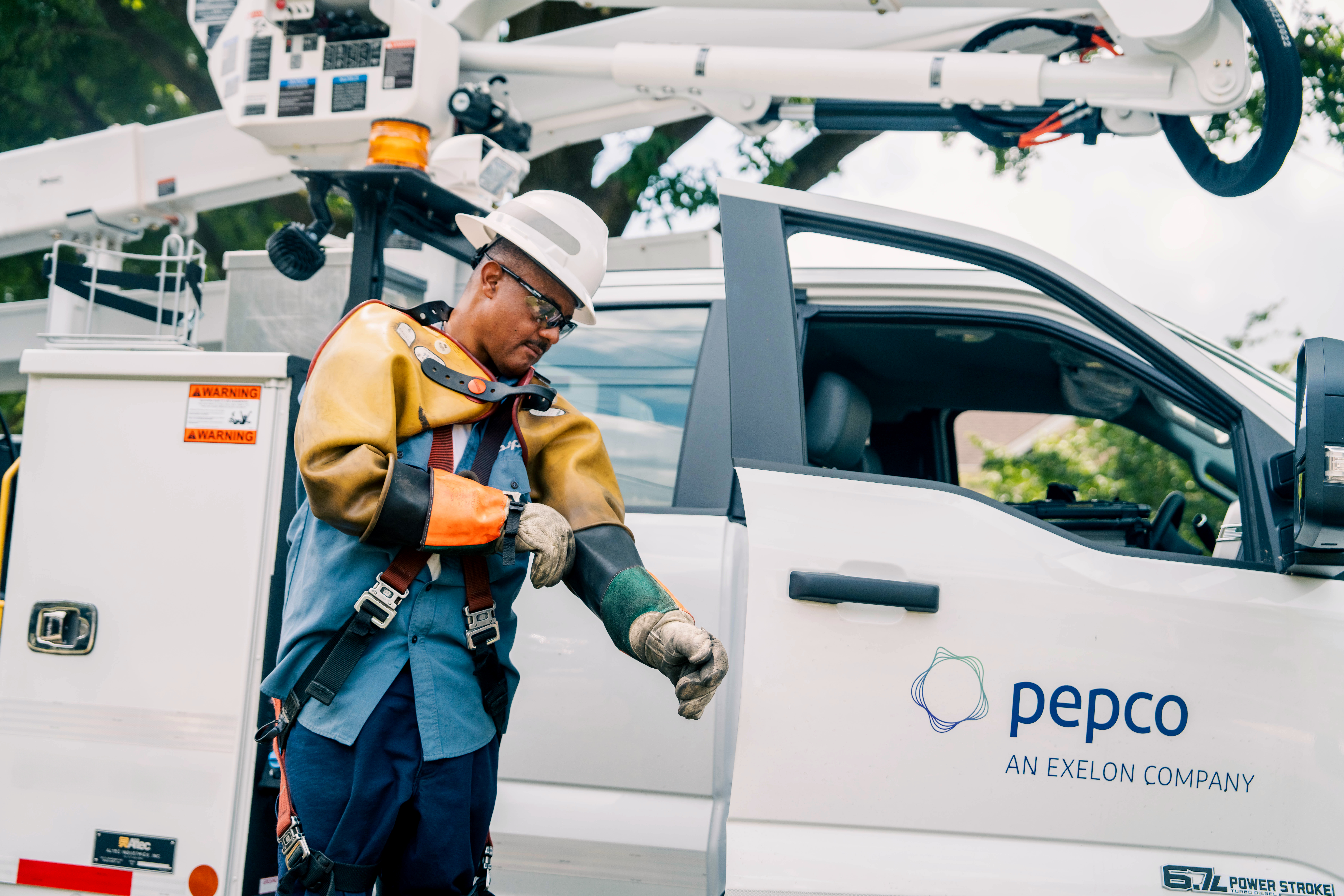 lineworker putting on PPE
