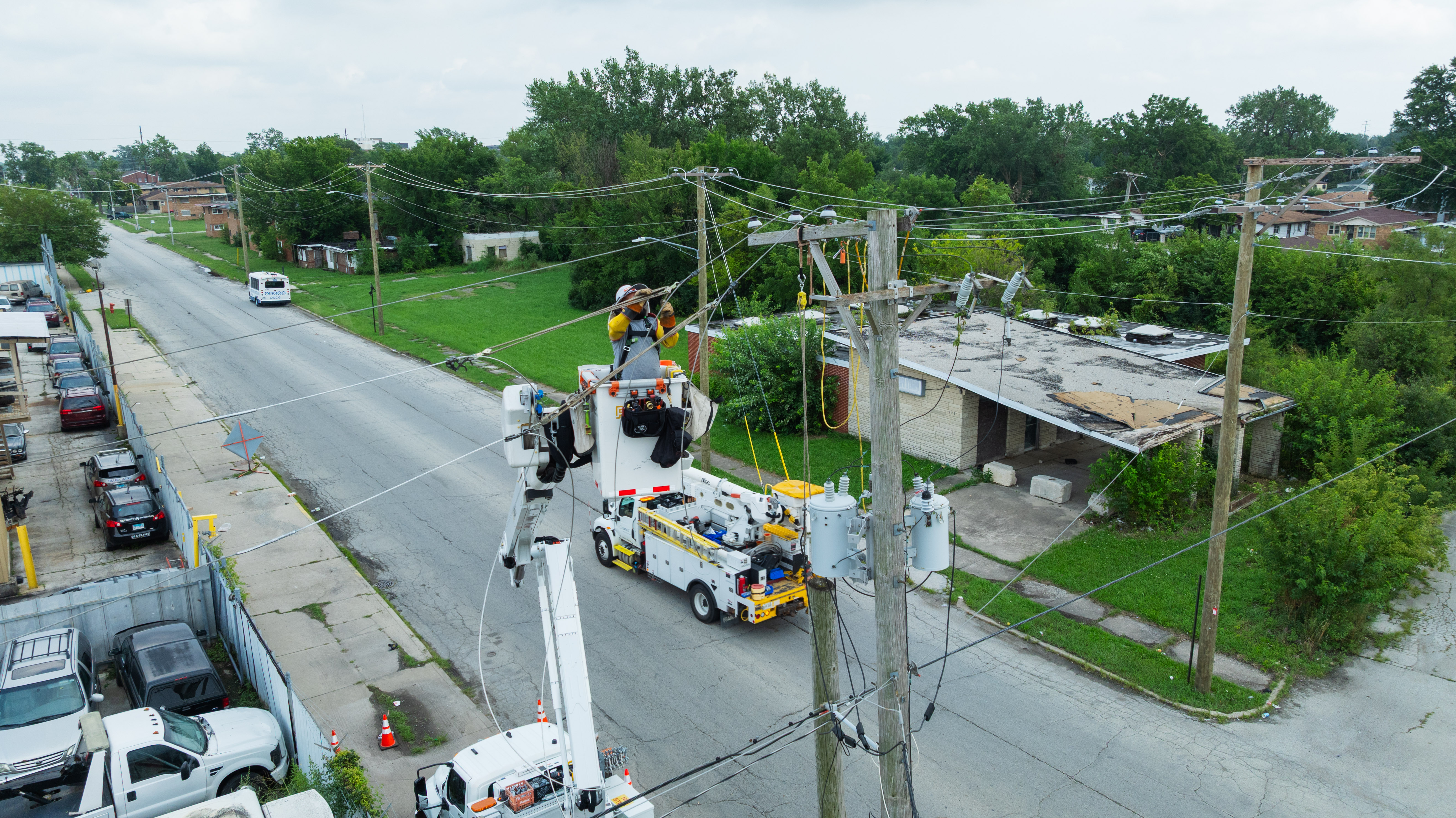Utility work working on a utility pole