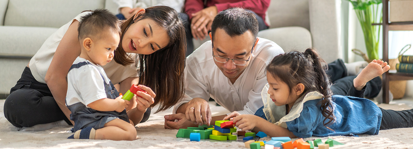 Family play board games on the floor